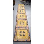 A LATE 19TH CENTURY CHINESE PRAYER RUG, decorated with panels of foliage. 355 cm x 62 cm.