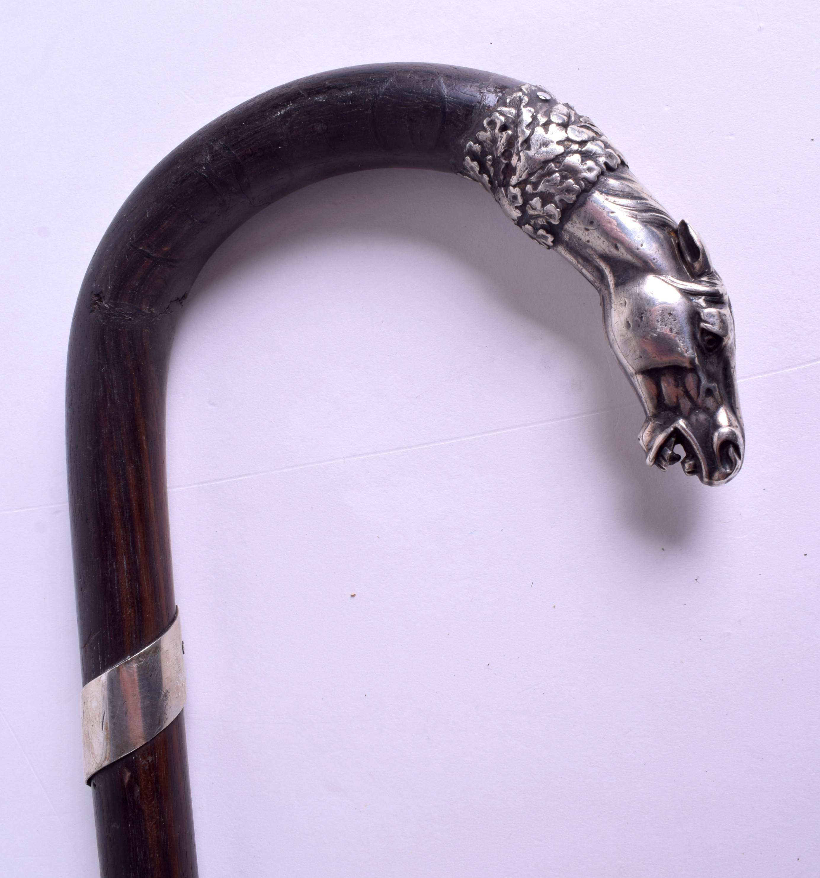 A 19TH CENTURY CONTINENTAL SILVER HORSE HEAD WALKING CANE possibly Russian. 83 cm long.