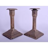 A PAIR OF ANTIQUE SILVER CANDLESTICKS. 32 oz (loaded). 14.5 cm high.