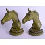 AN UNUSUAL PAIR OF 1920S CONTINENTAL COLD PAINTED IRON BOOK ENDS possibly Russian, in the form of a