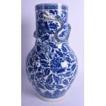 A LARGE 19TH CENTURY CHINESE BLUE AND WHITE VASE Qing, painted with flowers and overlaid with a dra