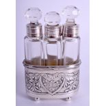 A 19TH CENTURY FRENCH SILVER MOUNTED TRIPLE GLASS SCENT BOTTLE. 7.5 cm x 5.25 cm.