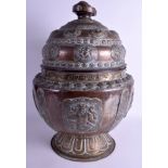 A VERY LARGE 19TH CENTURY INDIAN COPPER AND BRASS VESSEL AND COVER decorated with Buddhistic figure