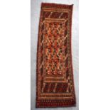 A SMALL 20TH CENTURY TEKKE TURKMEN TOBTA RUG, decorated with geometric symbols. 100 cm x 29 cm.