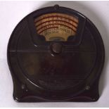 A BAKELITE PERPETUAL CALENDER, “Calendox Junior Round”. 12 cm x 11 cm.