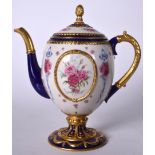 THE HOUSE OF FABERGE PORCELAIN TEA POT, decorated with flowers. 24 cm high.