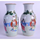 A PAIR OF EARLY 20TH CENTURY CHINESE FAMILLE ROSE VASES Guangxu, enamelled with figures under a tre
