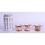 THREE ROYAL CROWN DERBY MINIATURE MUGS C1906, 1916 & 1922. 5 cm wide. (3)