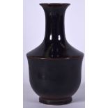 A CHINESE BROWN GLAZED PORCELAIN VASE BEARING GUANGXU MARKS, formed with a flared neck. 17 cm high.