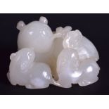 AN EARLY 20TH CENTURY CHINESE CARVED WHITE JADE FIGURE OF A CAT modelled with two young pups. 5.5 c