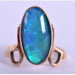 AN ART NOUVEAU 9CT GOLD AND OPAL RING. 3 grams. Size H.