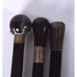A SPHERICAL AGATE NIGHT WATCHMAN WALKING CANE, together with two other canes. (3)