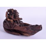 A RARE 19TH CENTURY CHINESE CARVED WOOD LIBATION CUP RAFT of Rhinoceros horn form. 18 cm wide.