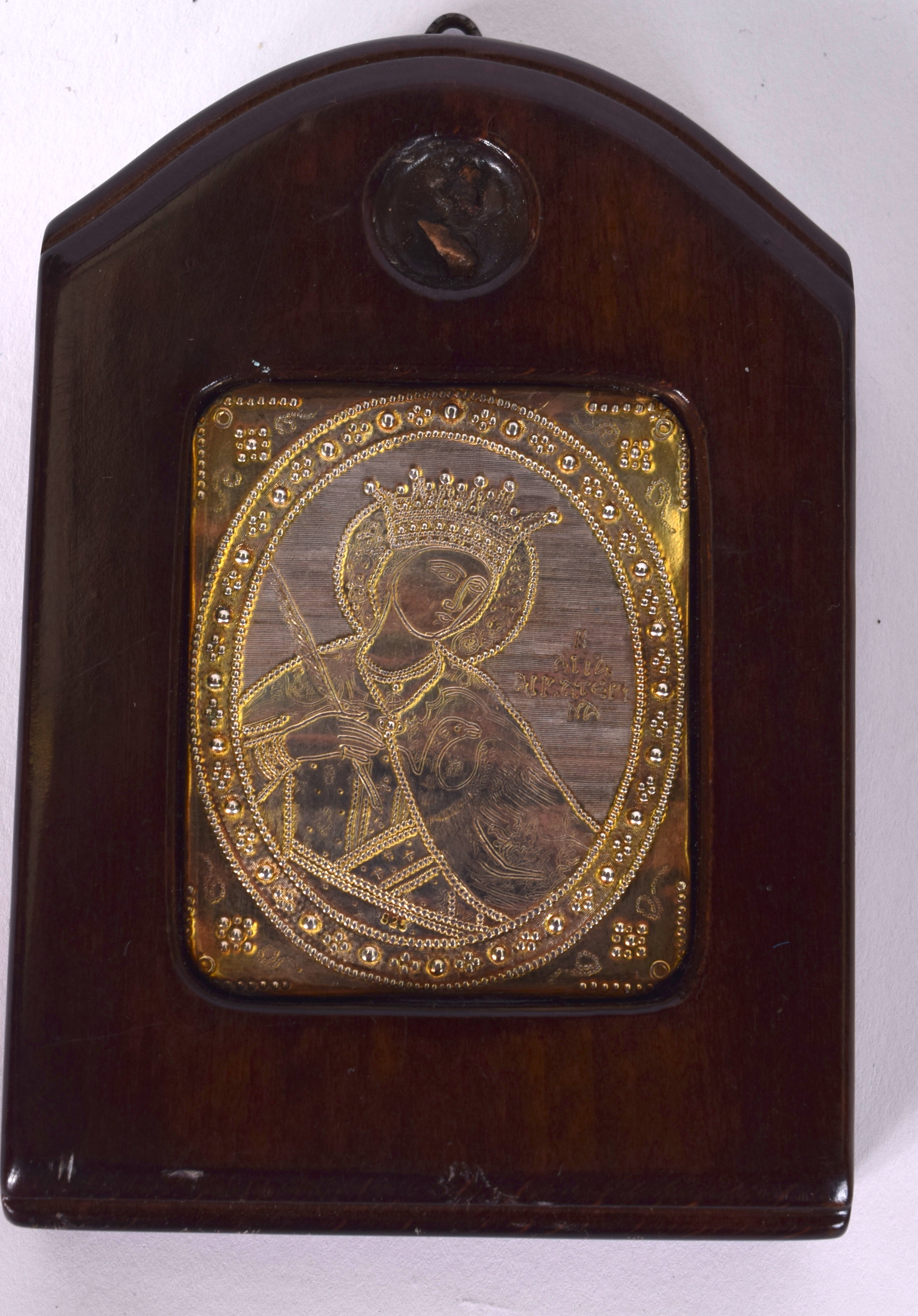 A RUSSIAN WHITE METAL PANEL, contained within a wooden mount. 11 cm x 7.5 cm.