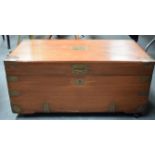 A WOODEN CAMPAIGN CHEST, formed with brass strapping and cartouche. 36 cm x 73 cm.