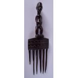 AN EARLY 20TH CENTURY AFRICAN TRIBAL CARVED WOOD FERTILITY COMB. 28 cm x 9 cm.