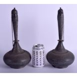 A LARGE PAIR OF 19TH CENTURY INDIAN KASHMIRI SILVER BOTTLES AND STOPPERS decorated with foliage. 40