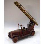 A PRE WAR TIN PLATE CLOCKWORK TOY FIRE ENGINE, “Dunlop Cord”. 36 cm wide.