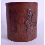 A 19TH CENTURY JAPANESE MEIJI PERIOD CARVED BAMBOO BRUSH POT decorated with a kneeling male. 12 cm