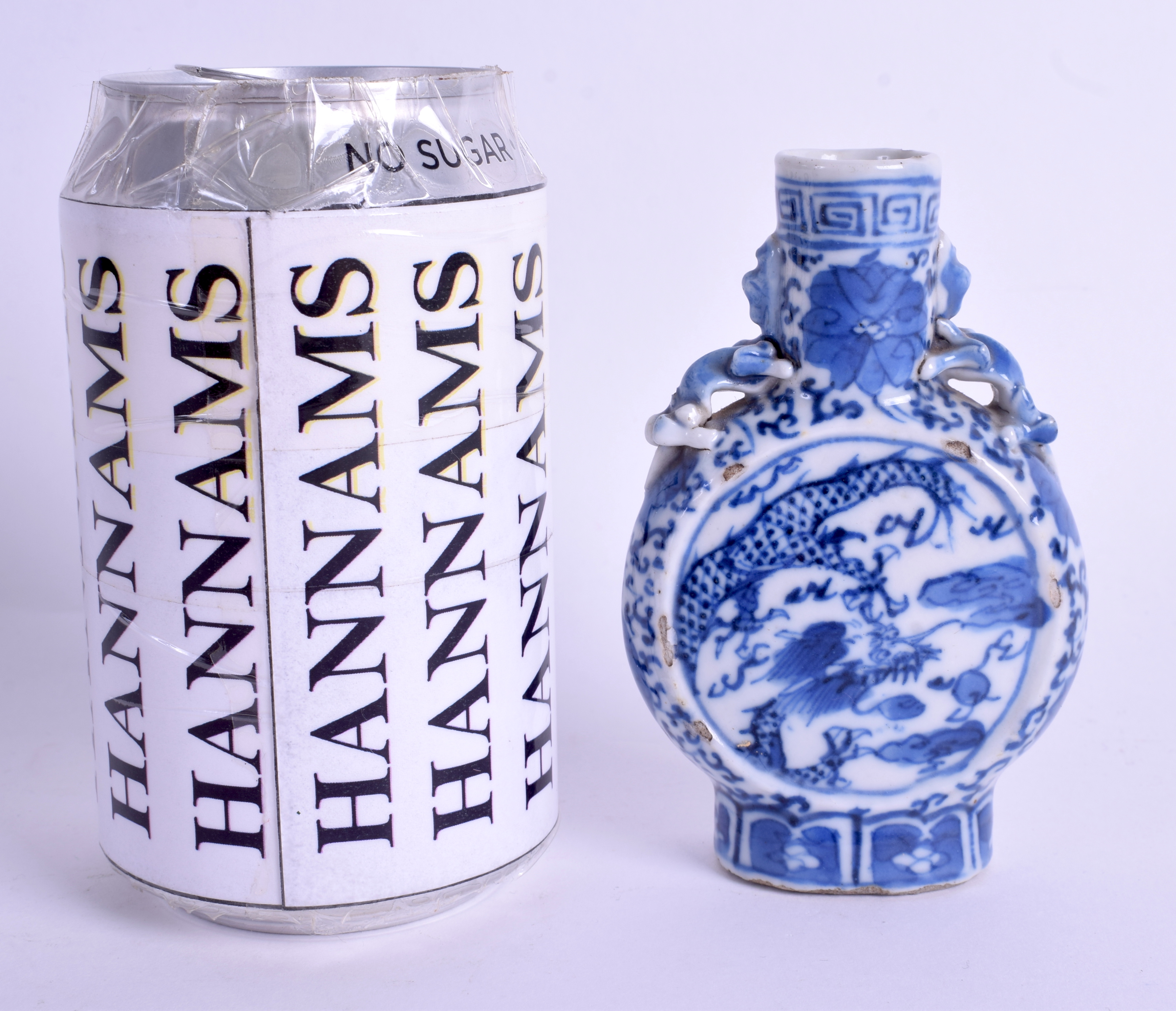 A SMALL 19TH CENTURY CHINESE BLUE AND WHITE MINIATURE MOON FLASK. 10 cm high.