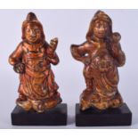 A PAIR OF 17TH/18TH CENTURY CHINESE POLYCHROMED CAST IRON BUDDHAS. 17 cm high.