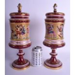 A LARGE PAIR OF LATE 19TH CENTURY VIENNA PORCELAIN VASES AND COVERS painted with figures upon a cla