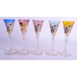 A SET OF FIVE ANTIQUE ENAMELLED LUMBER DRINKING GLASSES painted and gilded with ribbons. 19 cm high