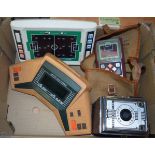 THREE VINTAGE HANDHELD CONSOLE GAMES, together with a Conway camera. (4)