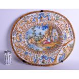 A LARGE 18TH/19TH CENTURY ITALIAN FAIENCE GLAZED MAJOLICA DISH decorated in relief with figures, li