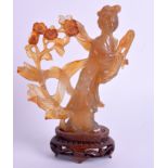 AN EARLY 20TH CENTURY CARVED AGATE FIGURE OF A DEITY Late Qing. Agate 14 cm x 10 cm.