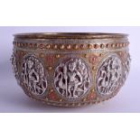 A 19TH CENTURY INDIAN SILVER COPPER AND BRASS BUDDHISTIC BOWL decorated with figures in various pur