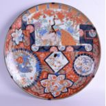 A VERY LARGE 19TH CENTURY JAPANESE MEIJI PERIOD IMARI CHARGER painted with Buddhistic lions. 50 cm