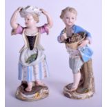 A PAIR OF 19TH CENTURY MEISSEN PORCELAIN FIGURES modelled upon gilt rococo bases. 14 cm high.