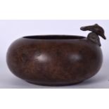 A CHINESE TERRACOTTA CENSER WITH DOPHIN HANDLE, incised with calligraphy. 16.5 cm wide.