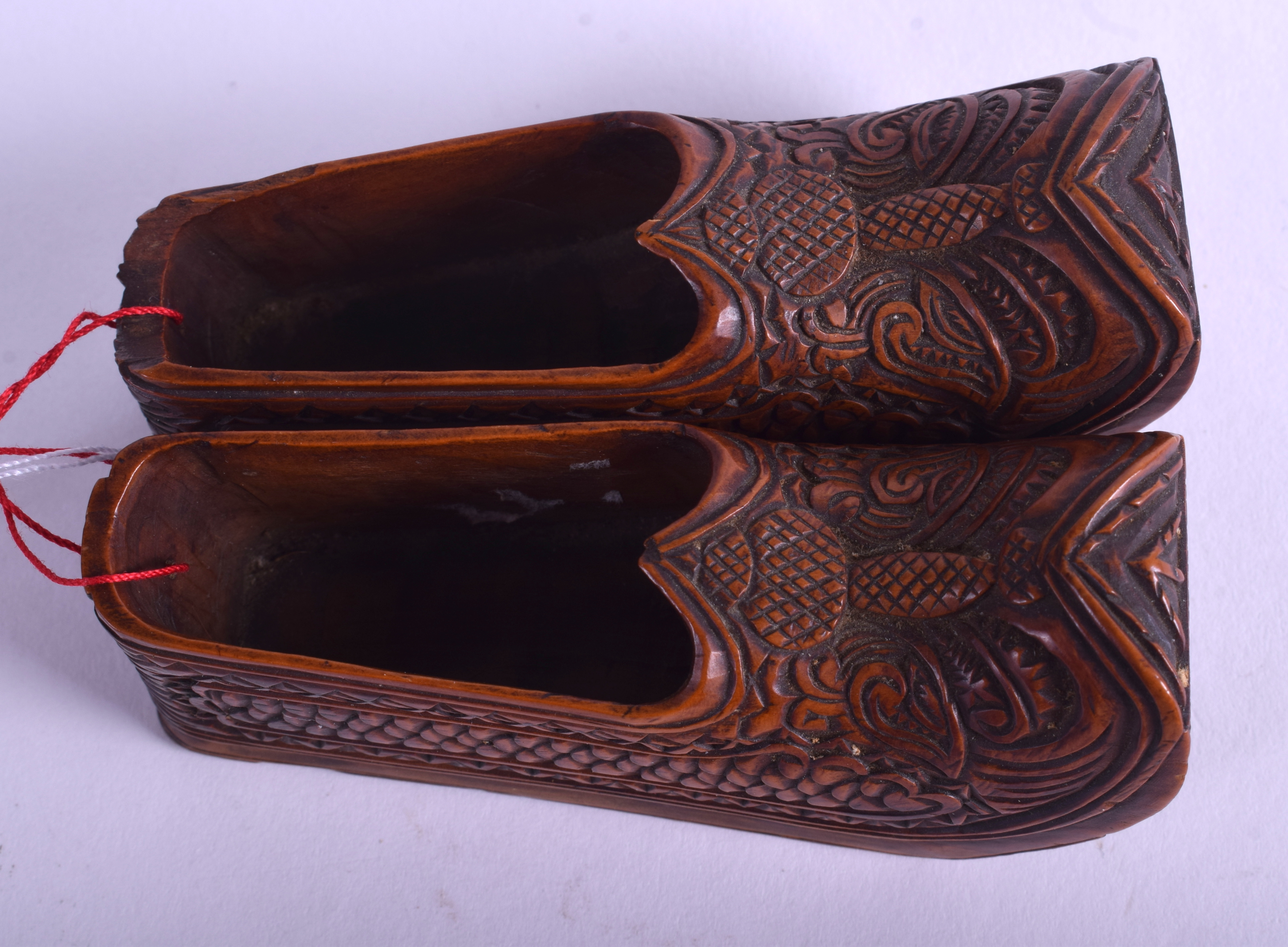 A PAIR OF 19TH CENTURY CONTINENTAL FRUITWOOD CLOGS carved with motifs. 8 cm long. - Image 3 of 4