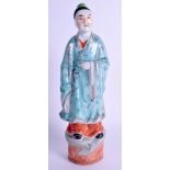 AN EARLY 20TH CENTURY CHINESE TURQUOISE GLAZED PORCELAIN FIGURE painted with motifs. 31 cm high.