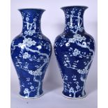 A LARGE PAIR OF CHINESE BLUE AND WHITE PORCELAIN BALUSTER VASE, decorated with the prunus tree. 51
