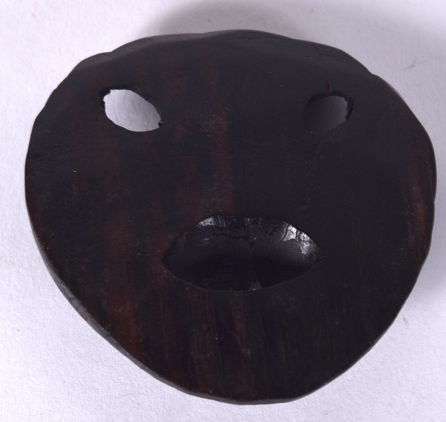 AN EARLY 20TH CENTURY CHINESE HARDWOOD BELT BUCKLE, in the form of a snarling demon. 5.2 cm x 4.8 c - Image 2 of 2