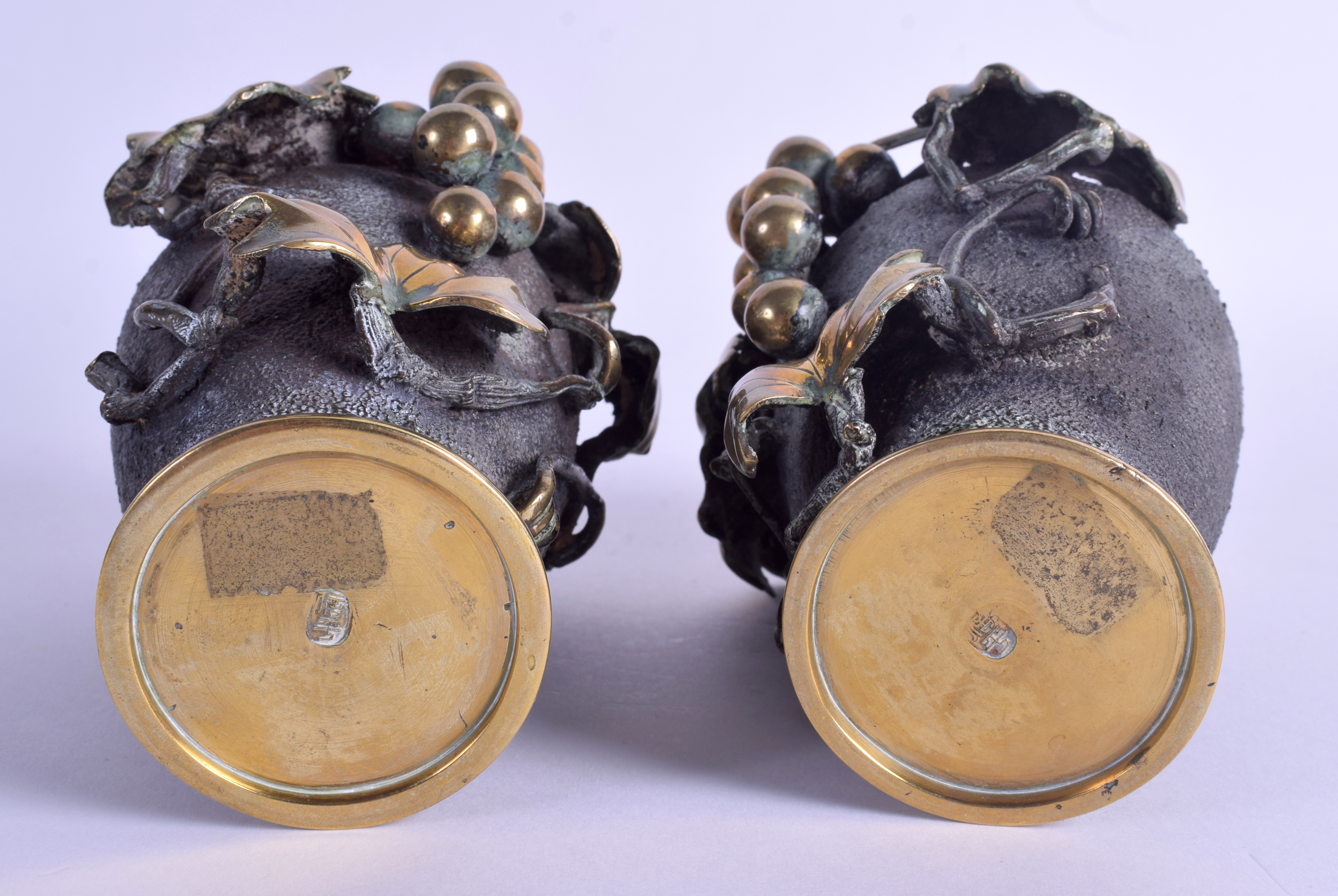 A PAIR OF 19TH CENTURY JAPANESE MEIJI PERIOD BRONZE VASES overlaid with berries and vines. 16 cm hi - Image 3 of 4