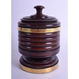 A WILLIAM IV TURNED TREEN FRUITWOOD TEA CADDY AND COVER with brass banding. 16 cm x 10 cm.