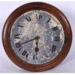 AN EARLY 20TH CENTURY CIRCULAR WALL CLOCK, formed with a cream dial and oak case. 41 cm diameter.