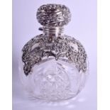 AN ANTIQUE SILVER OVERLAID CRYSTAL GLASS SCENT BOTTLE decorated with foliage and vines. 12 cm x 8 c