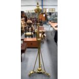 A VICTORIAN BRASS STANDARD LAMP OF GOLFING INTEREST, stamped “Dreadnought”. 162 cm high.