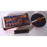 A VINTAGE BOXED “TWINKLING EYES” SPECTACLES, together with a French box and popping snake. (3)