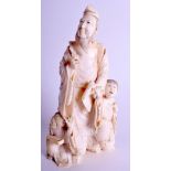 A 19TH CENTURY JAPANESE MEIJI PERIOD CARVED IVORY OKIMONO modelled as a male scholar with two child