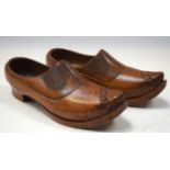 A PAIR OF EARLY 20TH CENTURY CONTINENTAL TREEN CLOGS with flower decoration to foot. 24 cm long.