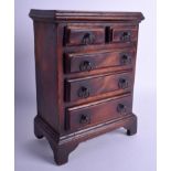 AN EARLY 19TH CENTURY FLAME PLUM MAHOGANY SPICE CHEST in the form of a George III chest. 23 cm x 14