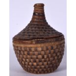 AN EARLY 20TH CENTURY NATIVE AMERICAN COILED WOVEN GRASS BASKET, together with cover. 24 cm high.