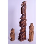 THREE 1960S CANADIAN NORTH WEST COAST TOTEM POLE FIGURES signed A O J. largest 36 cm high. (3)