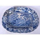 A LARGE ANTIQUE STAFFORDSHIRE BLUE AND WHITE POTTERY PLATTER, decorated with figures on horses in a